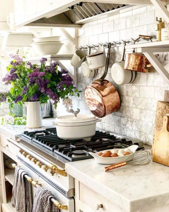 copper pans hanging on wall
