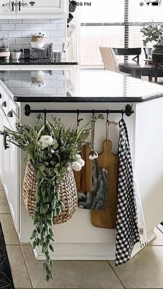 hang cutting boards and basket on side of kitchen island