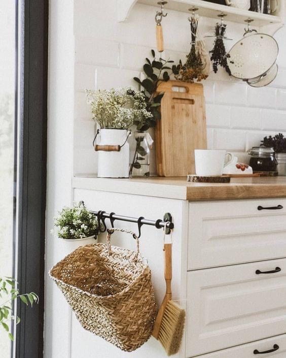hanging rattan basket on side of kitchen counter