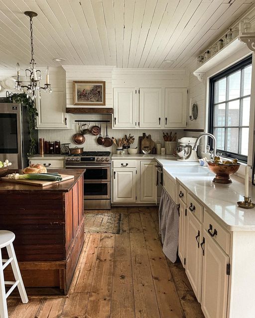 pots and pans hanging above stove farmhouse kitchen decor