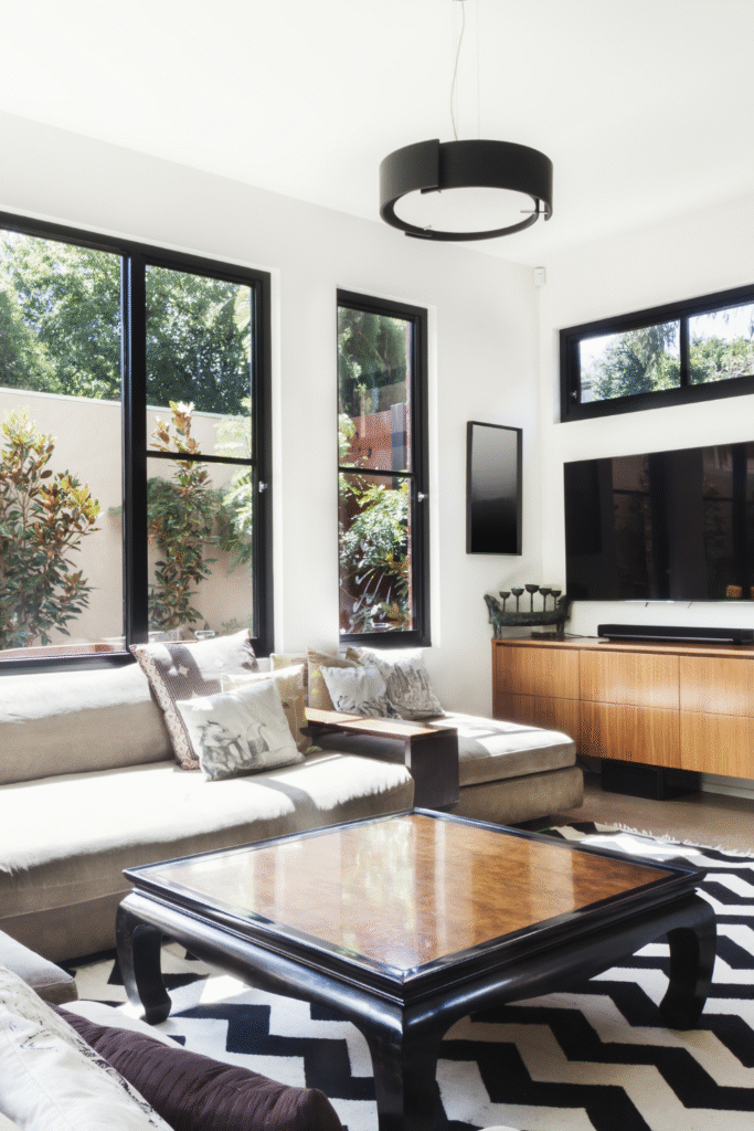 18 Common Living Room Layout Mistakes You Might Be Making (But Can Totally Fix) 8 8. Display Travel Souvenirs 4
